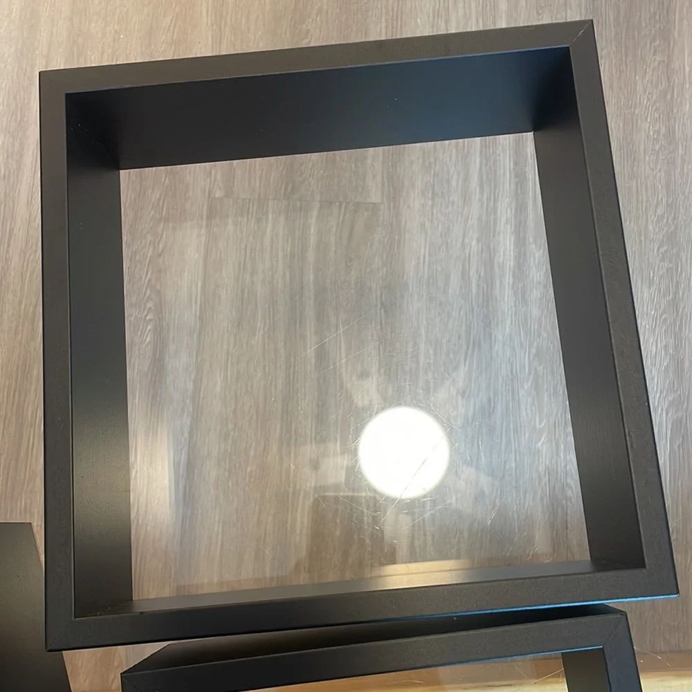 3 black shelving units